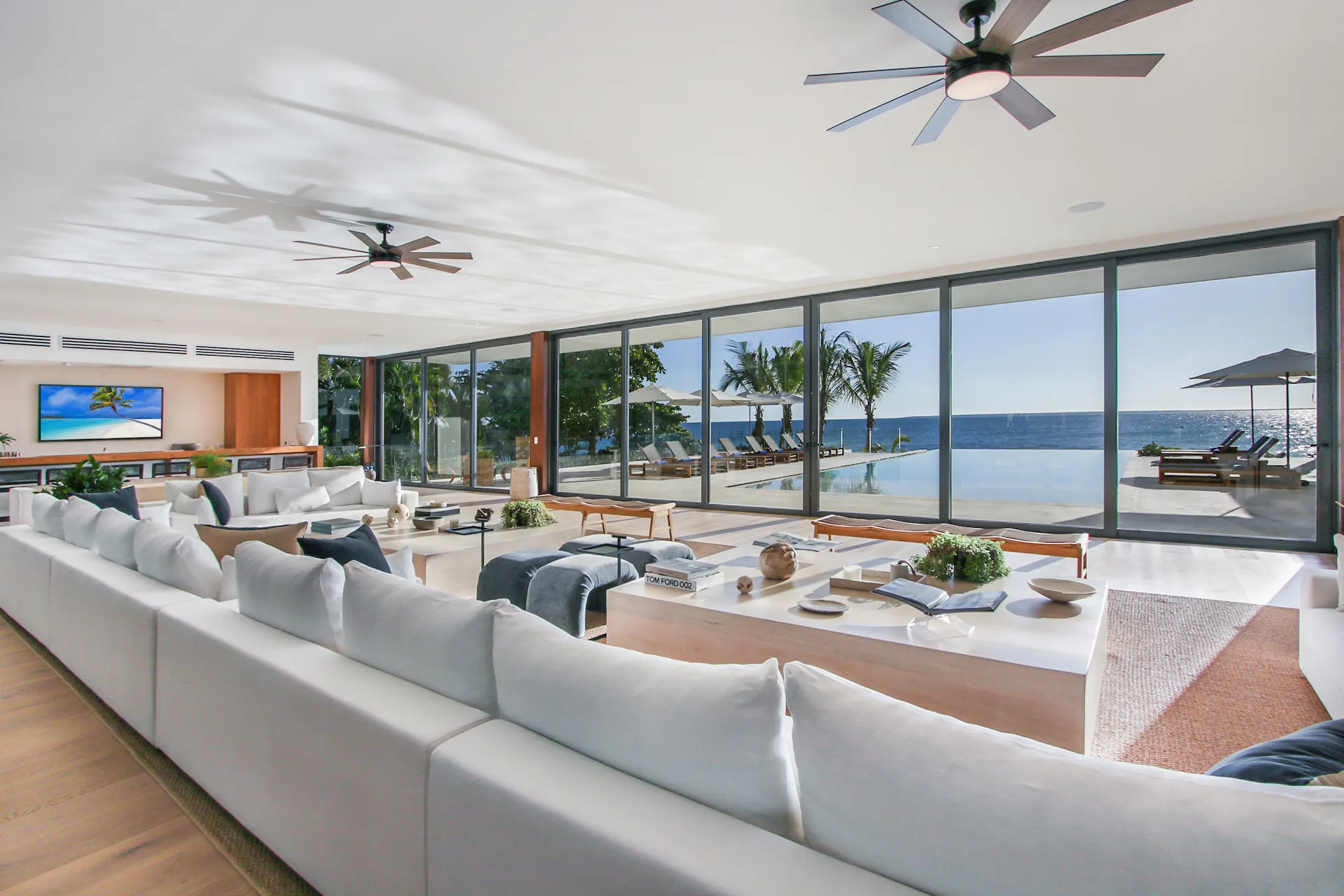 Open-plan living room with ocean views at Villa Caleton 24, Casa de Campo beachfront villa La Romana