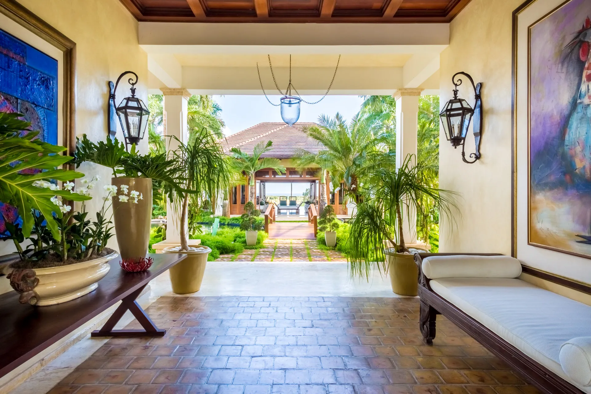 Villa entrance with tropical plants and art at Vista Chavon 13 Casa de Campo resort, La Romana DR