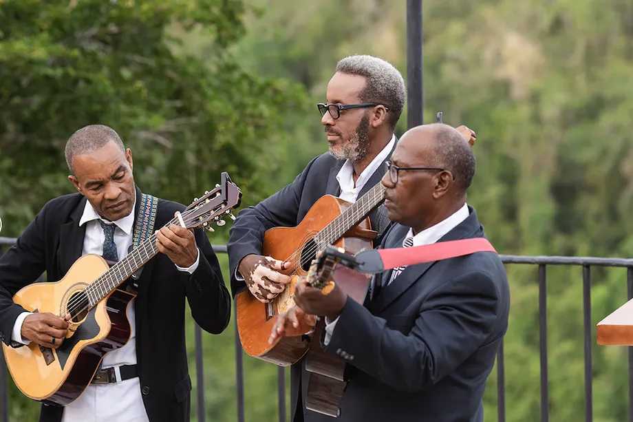 Live music trio performing at a villa event