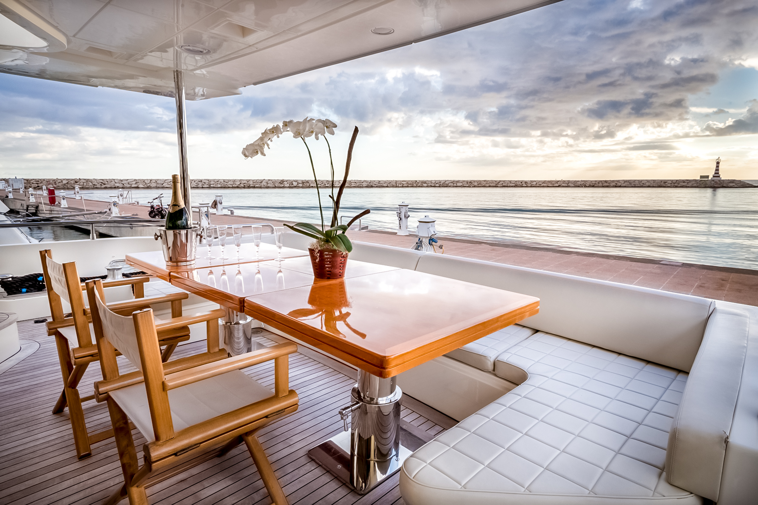 Champagne on the aft deck of a charter yacht at sunset, Casa de Campo Marina
