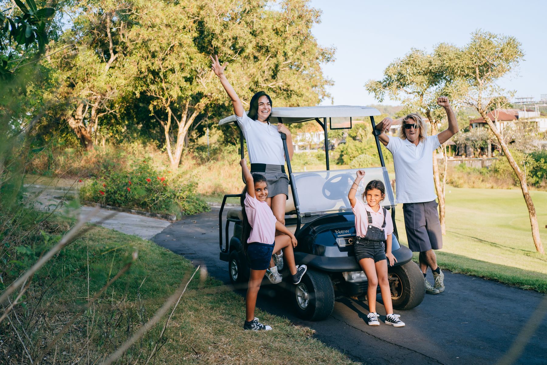Family arriving by golf cart at their Casa de Campo villa
