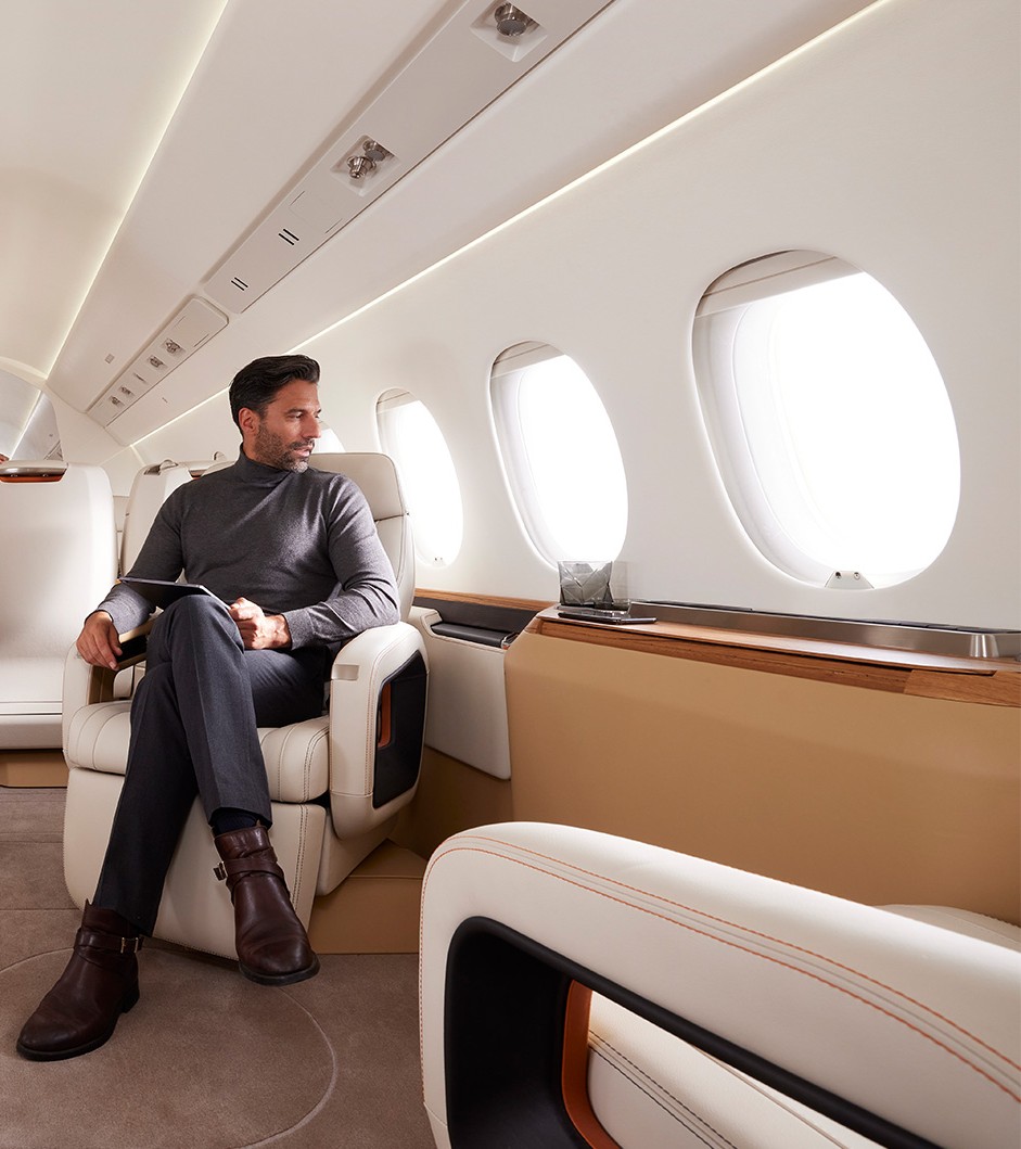 A guest working in the cabin of a private jet chartered to La Romana, Dominican Republic