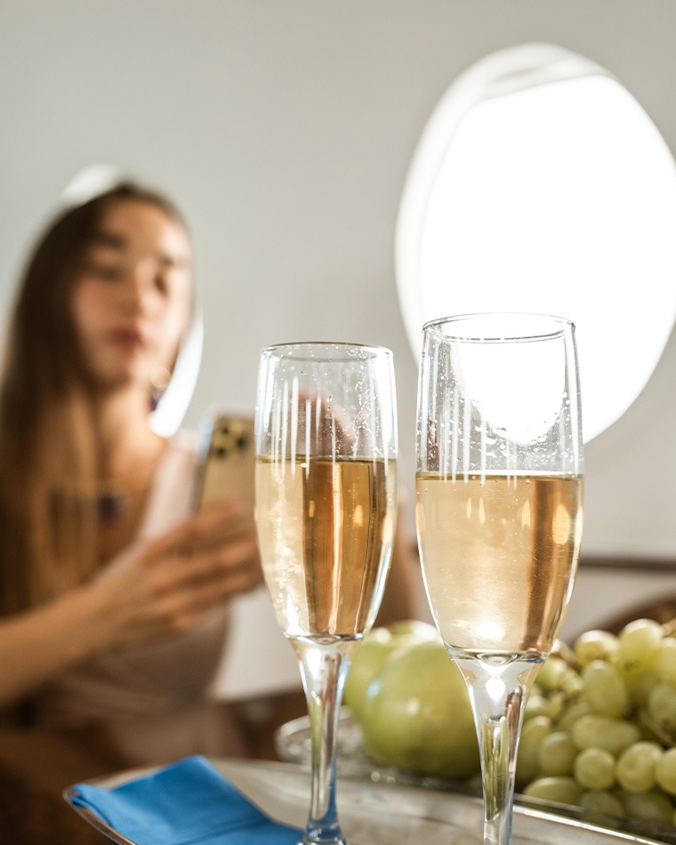 Champagne served in the cabin of a private jet en route to La Romana, Dominican Republic